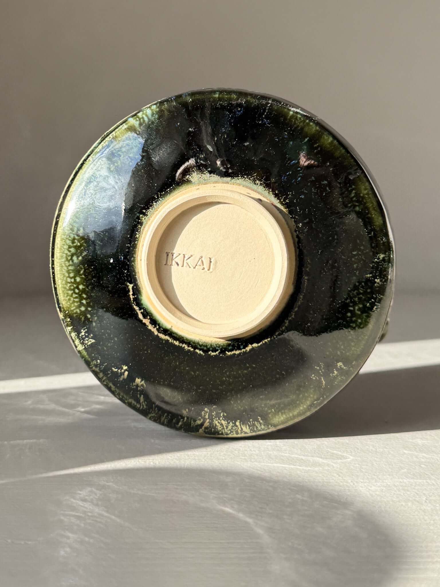 Underside of Textured Matcha Bowl Spout - Hinoki #03 with glossy green glaze