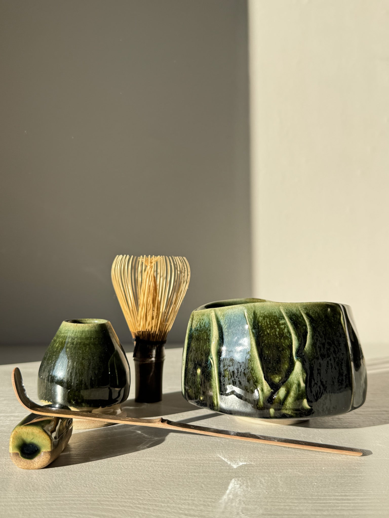 Textured Matcha Bowl - Hinoki #16 with bamboo whisk and tea accessories, showcasing green glaze and textured finish.