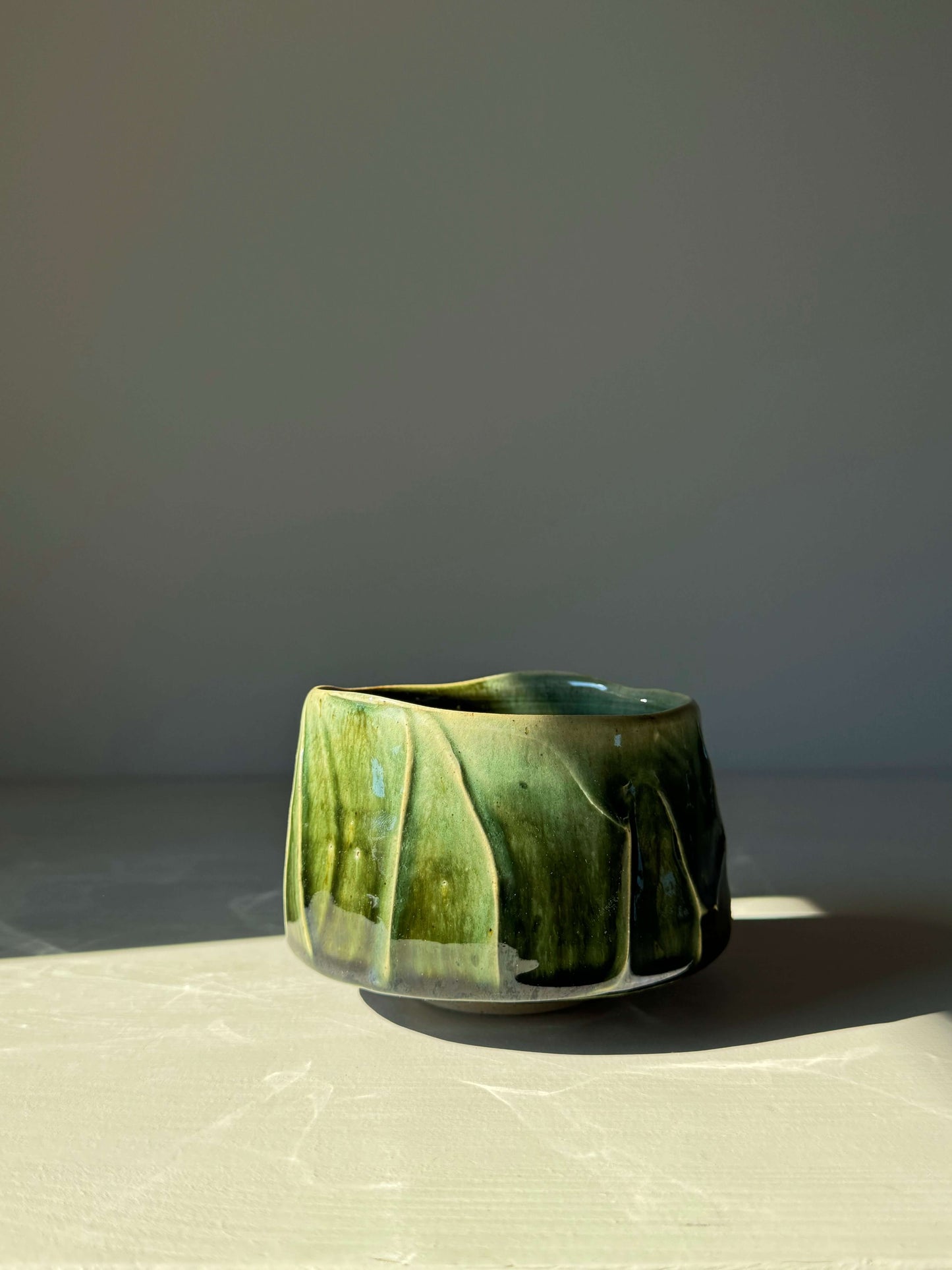 Textured green matcha bowl from Hinoki Series, inspired by Hinoki tree, with unique glaze and finish for a peaceful matcha ritual.