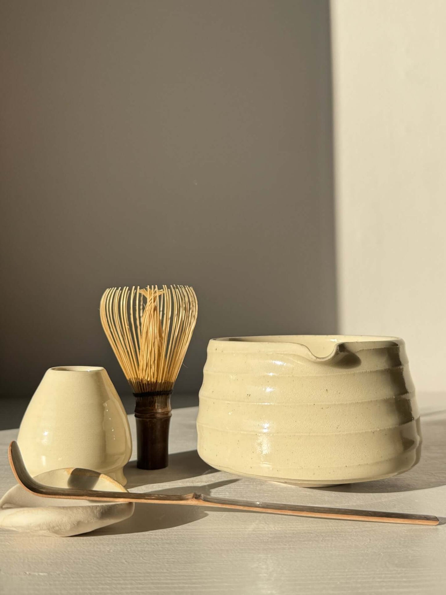 Textured Matcha Bowl Spout - Clear #02 with whisk, spoon, and accessory under natural light