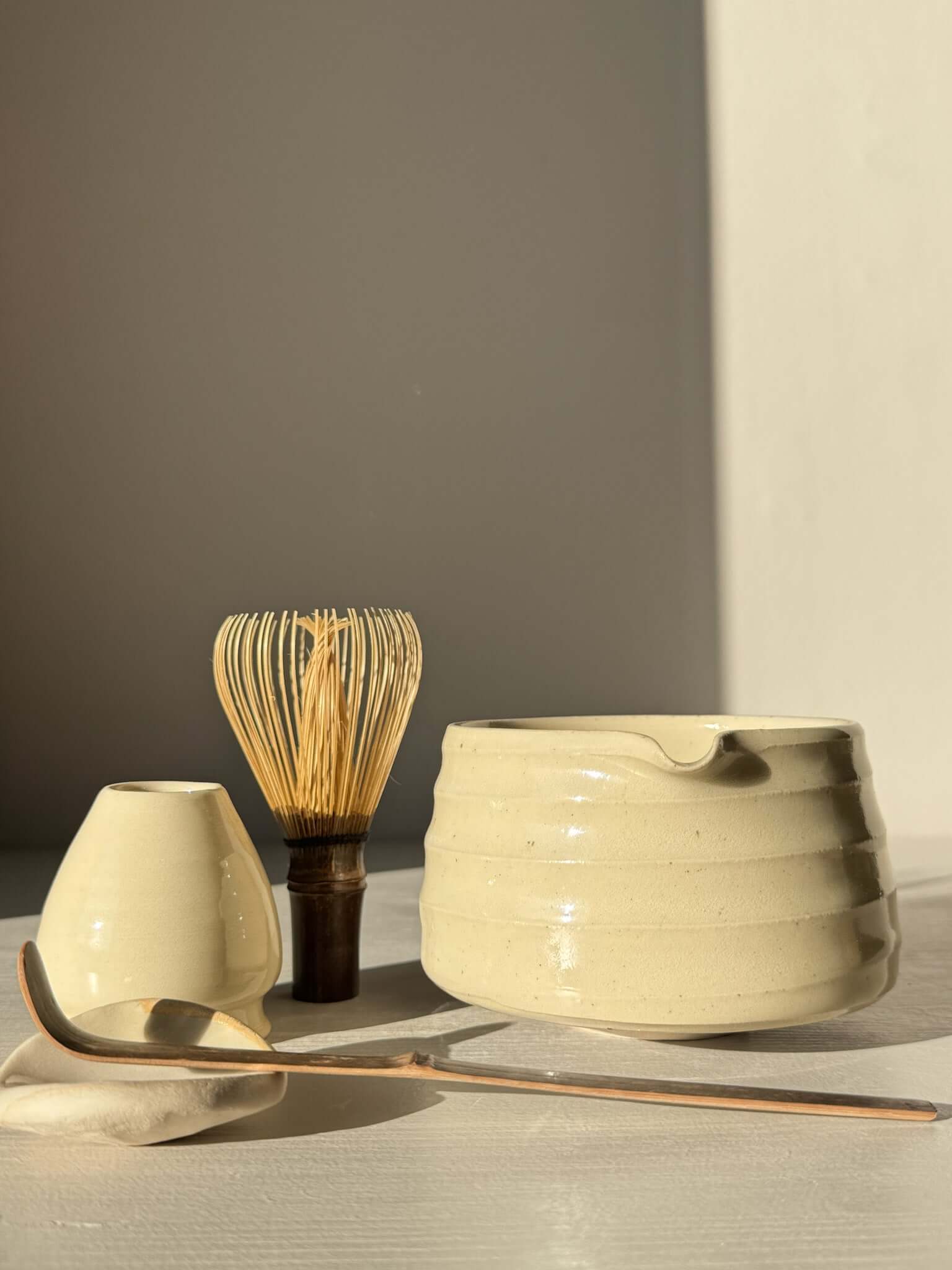 Textured Matcha Bowl Spout - Clear #02 with whisk, spoon, and accessory under natural light