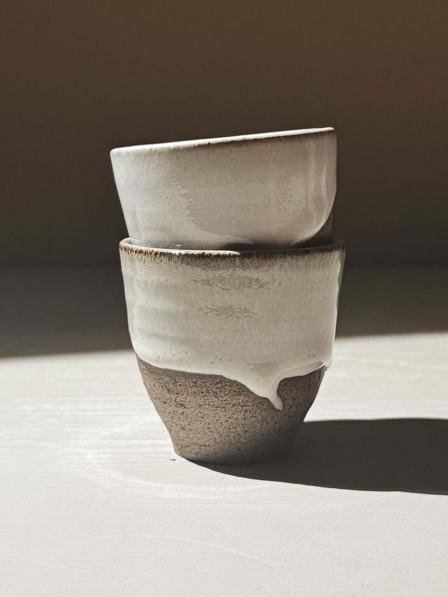 Espresso Cup - Yuki Ash, handmade stoneware cup with glossy white glaze and textured clay.