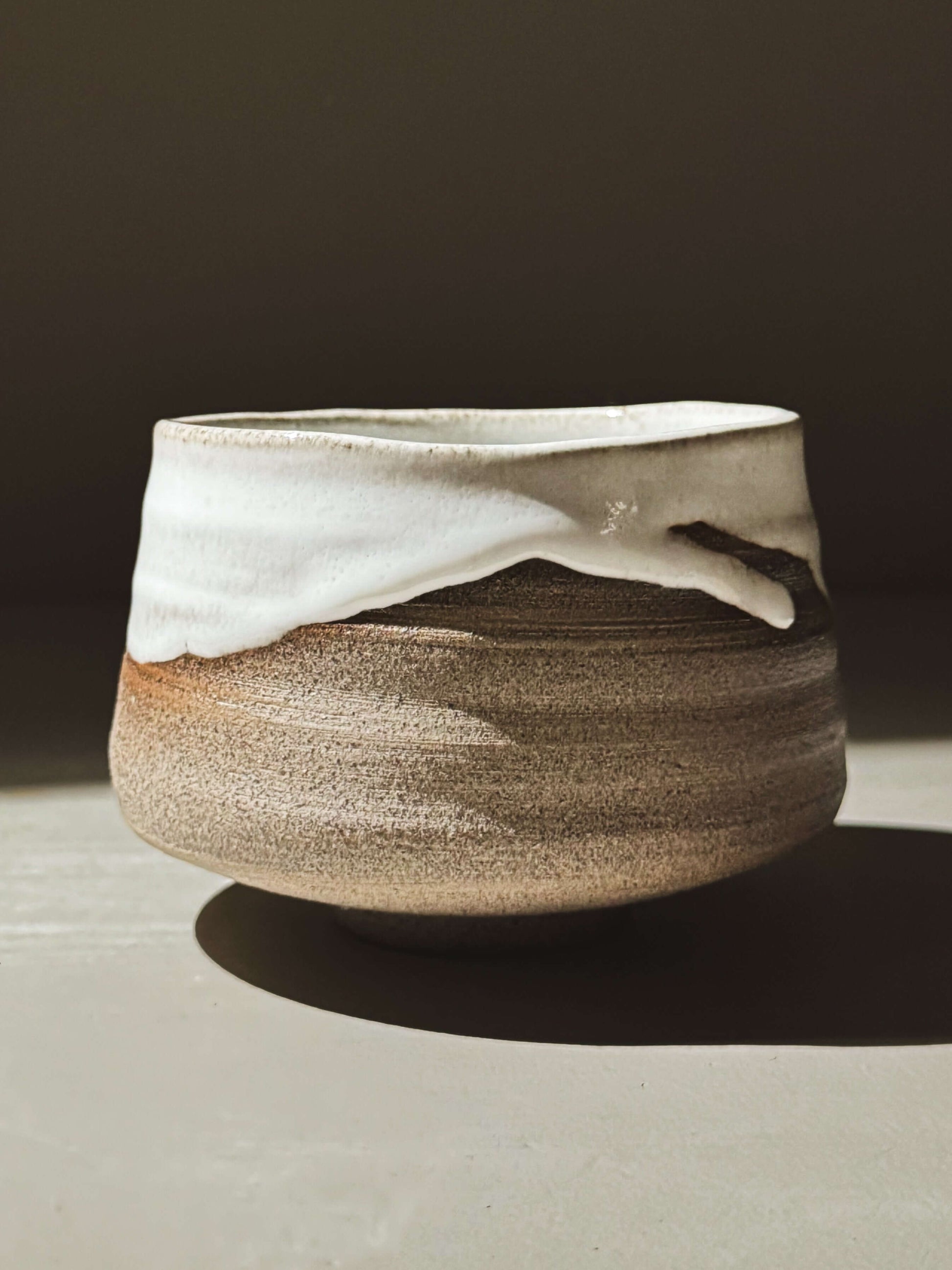 Matcha Bowl – Yuki Ash #01 with glossy white glaze on ash-grey clay, showcasing natural glaze movement and handmade details.