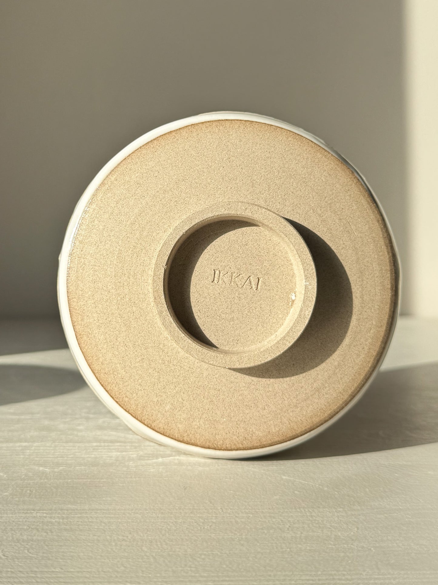 Underside of Matcha Bowl – Yuki Branches #02 showing craftsmanship and stamp detail in natural light.