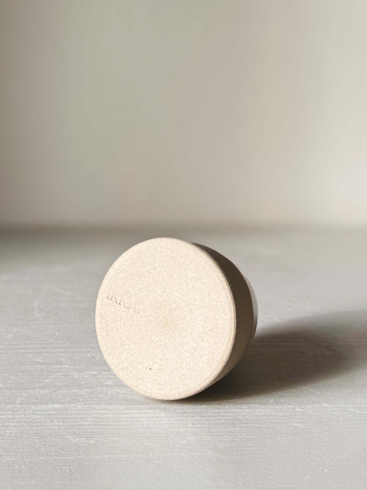 Base view of Small Vase – Yuki #02 showcasing matte raw clay finish and subtle design.