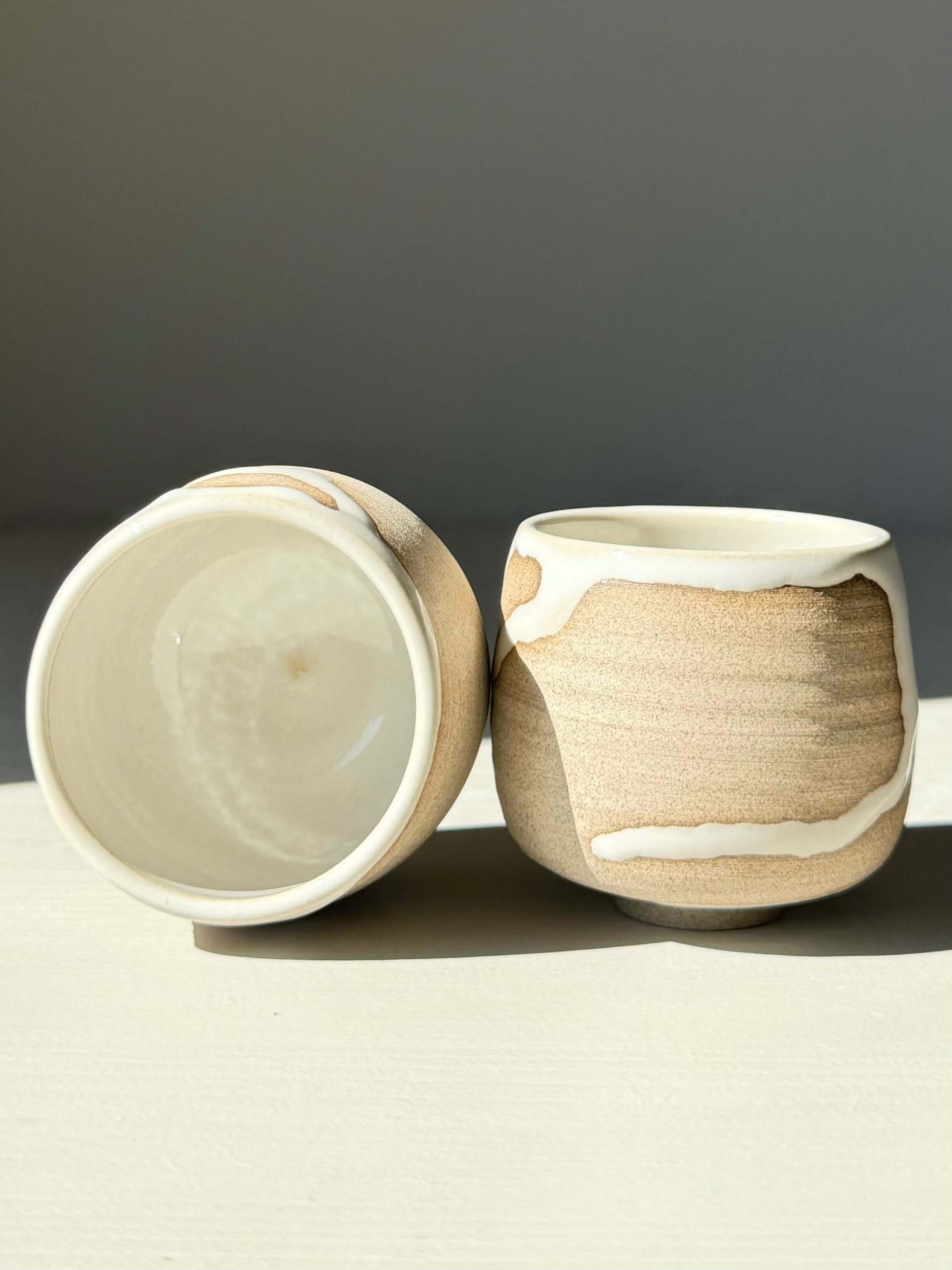 Sake set Yuki Series cups made from toffee clay with white glaze, showcasing unique designs in a warm, natural finish. Perfect for daily use.