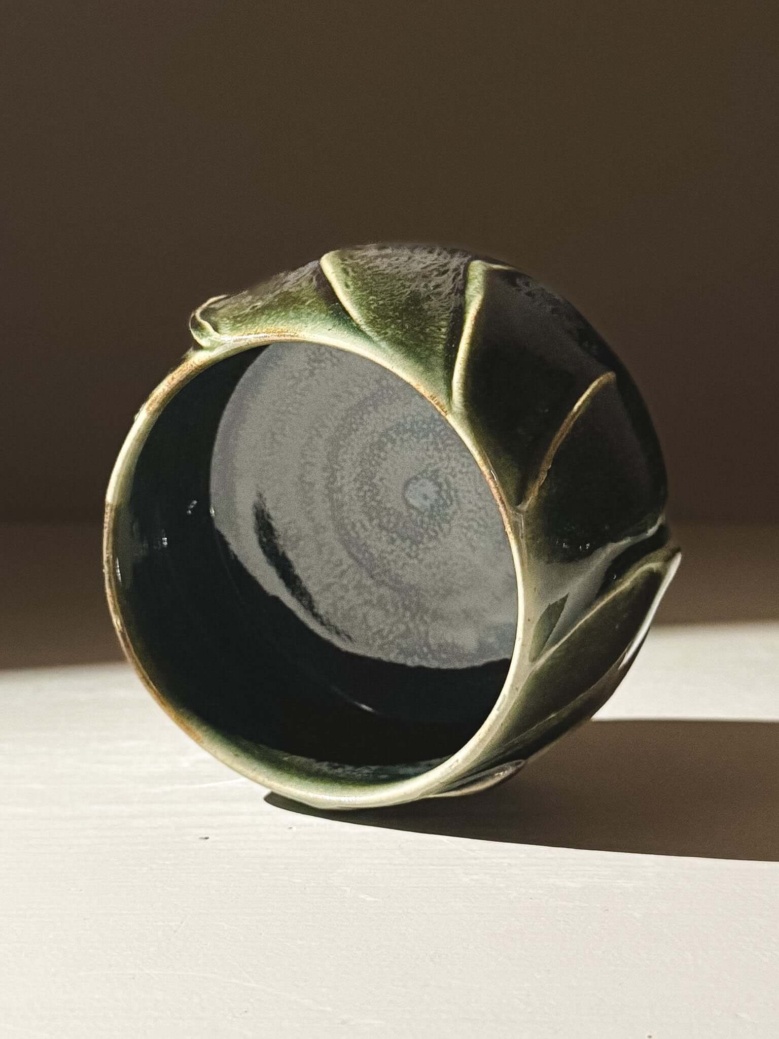 Yunomi Cup - Hinoki #00 with deep green glaze and slip decoration, showcasing unique texture and handmade artistry in natural light