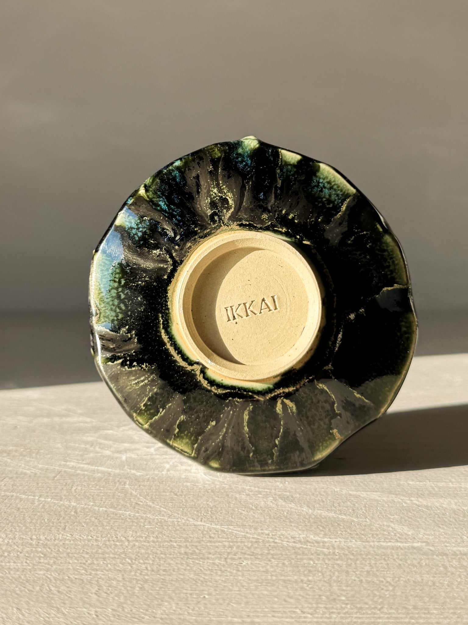 Base view of Yunomi Cup - Hinoki #07 with unique glaze pattern highlighting subtle texture and handcrafted artistry.