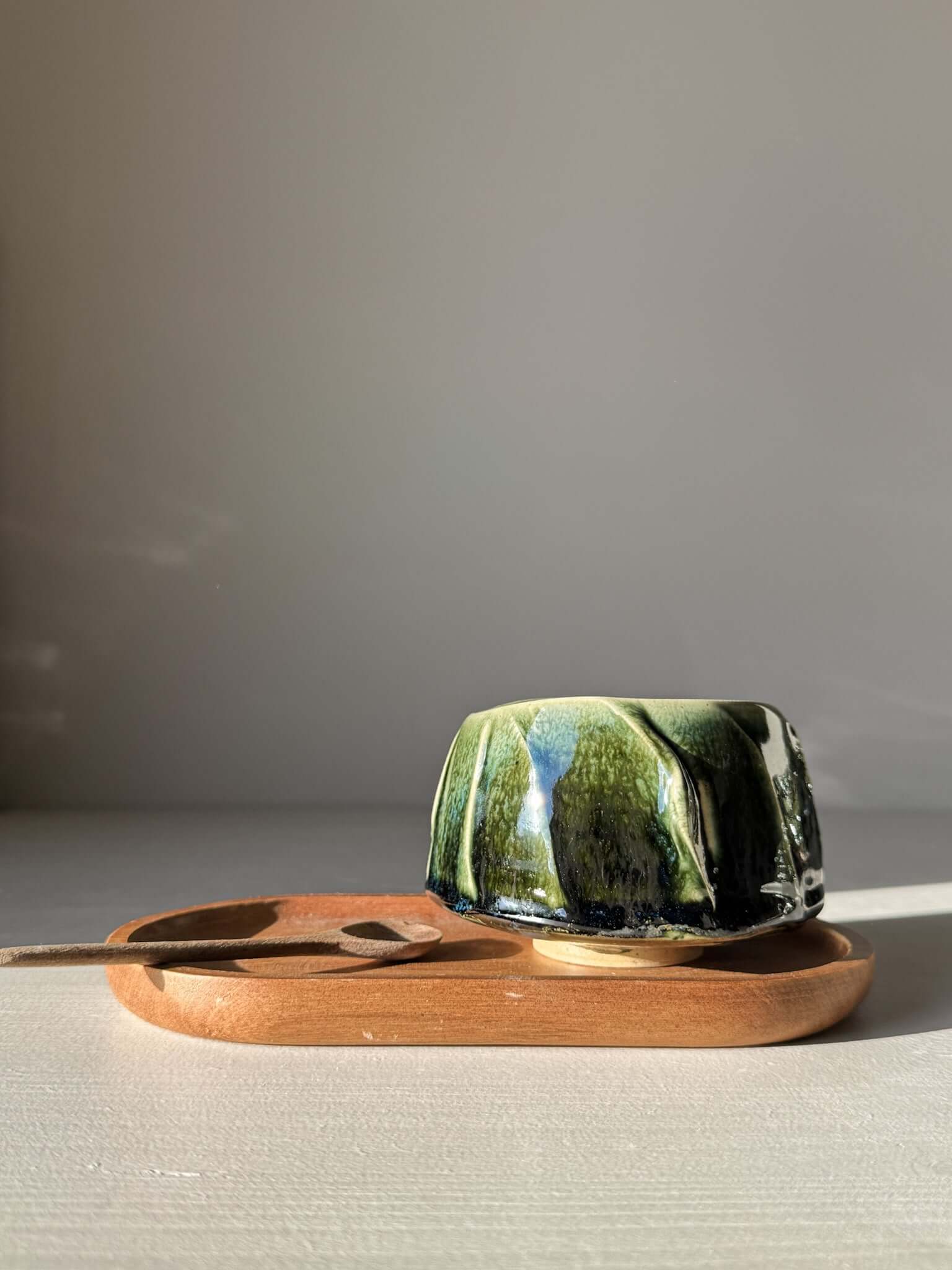 Handmade Yunomi Cup - Hinoki #09 with deep green glaze on wooden tray