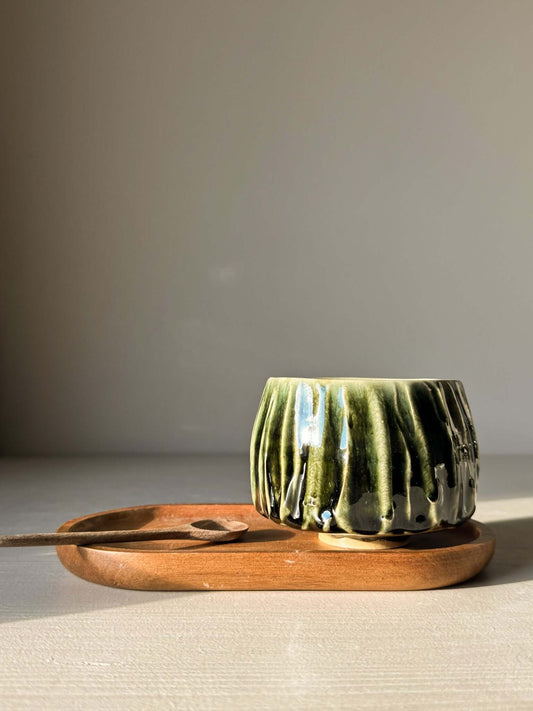 Yunomi Cup - Hinoki #12 with deep green glaze on rustic wooden tray, featuring soft textured lines for a unique tea experience.