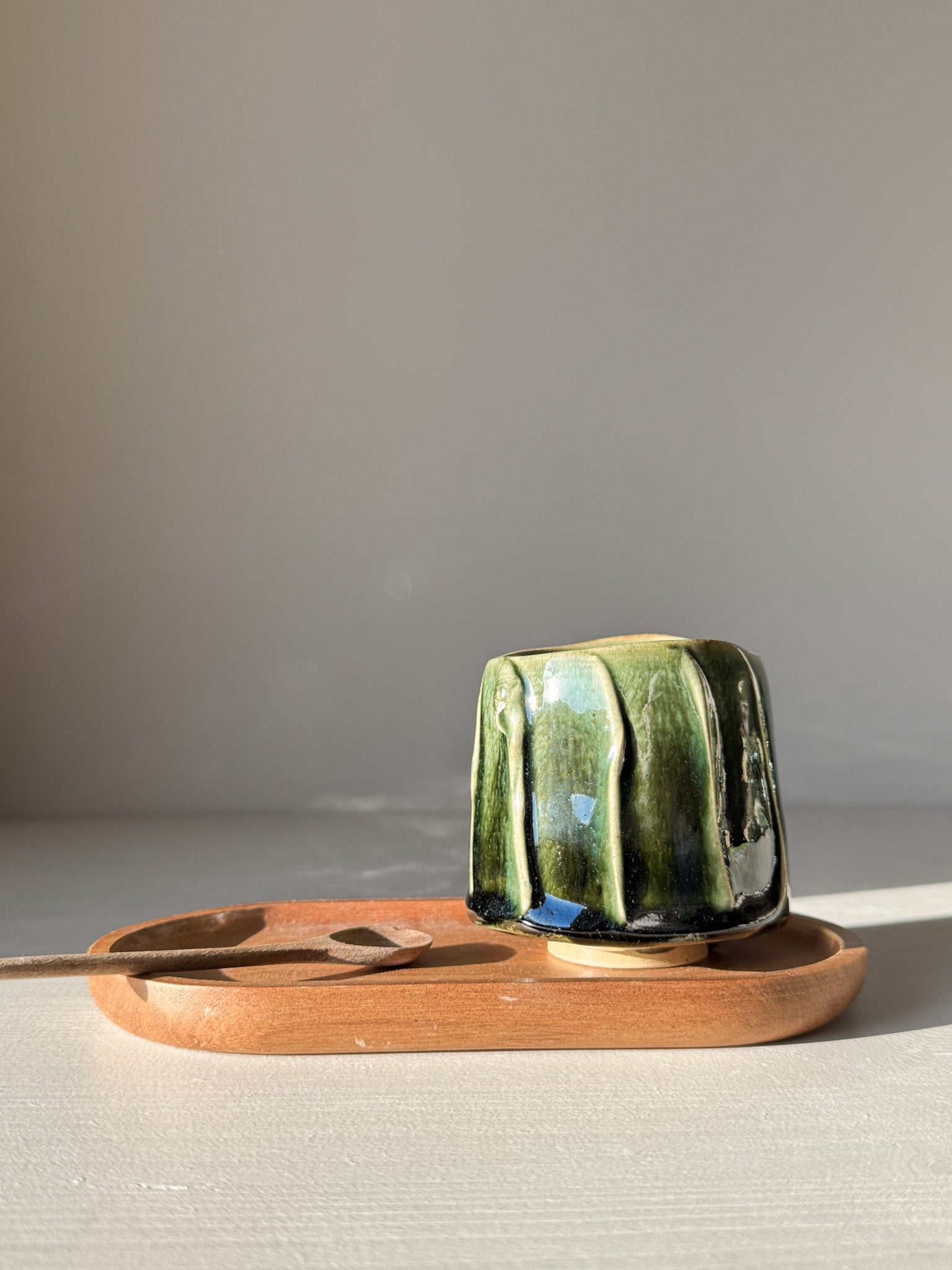 Yunomi Cup - Hinoki #15 with deep green glaze, hand-decorated slip texture on a wooden serving tray, ideal for tea moments.