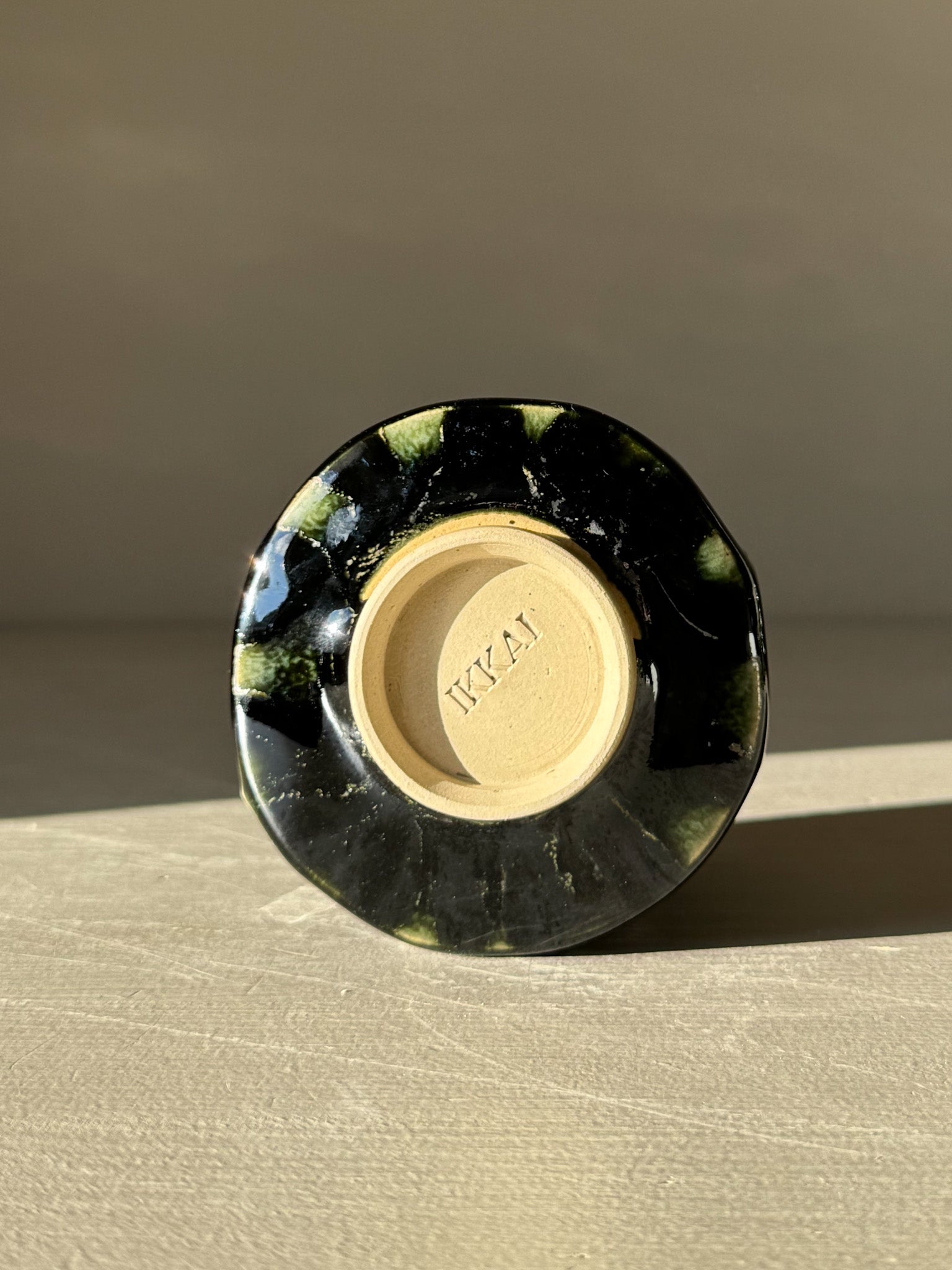 Bottom view of Yunomi Cup - Hinoki #16 showing detailed glaze and craftsmanship.