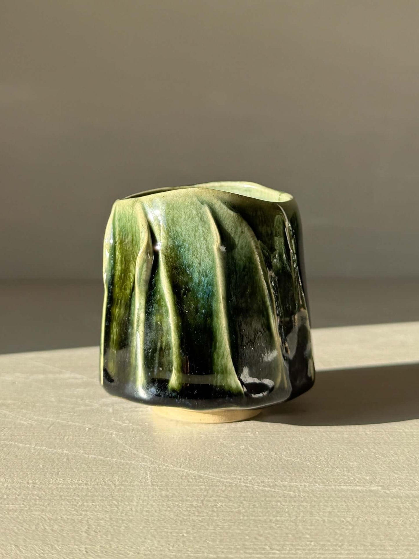 Handmade Yunomi Cup - Hinoki #16 with deep green glaze and textured slip decoration