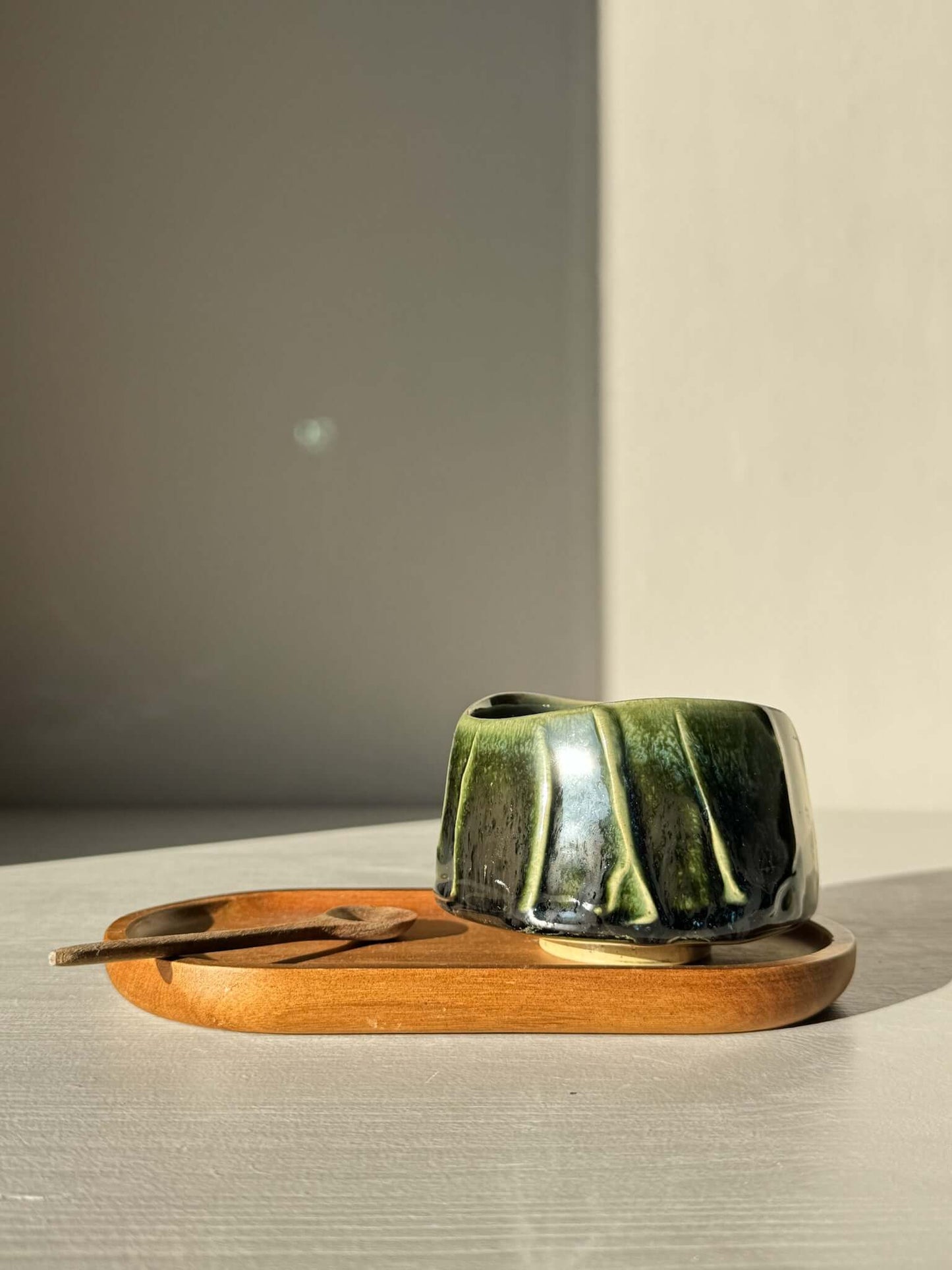 Yunomi Cup - Hinoki #29 on wooden tray with green glaze and unique slip texture, handmade for everyday tea moments.