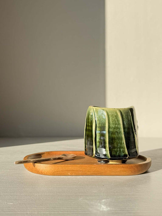 Yunomi Cup - Hinoki Series #19 in deep green glaze, placed on a wooden tray with a spoon, showcasing unique handcrafted design.