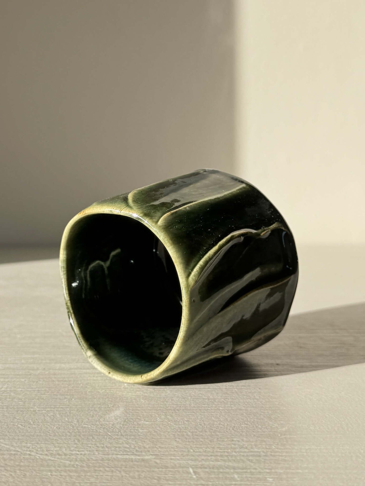 Yunomi Cup - Hinoki Series #21 with deep green glaze and hand-applied slip lines, showcasing unique texture and handcrafted artistry.