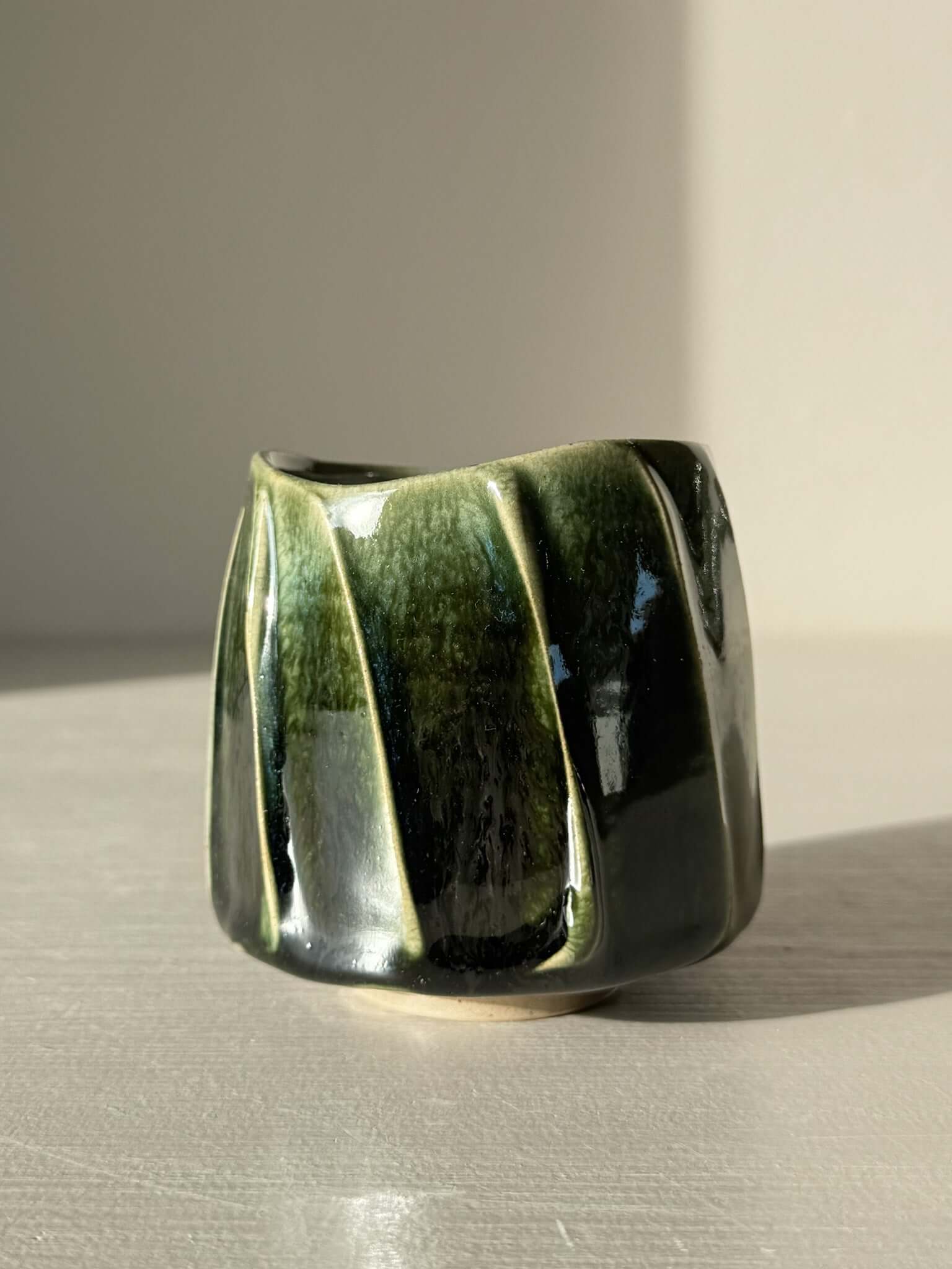 Yunomi Cup - Hinoki Series #23 with hand-applied slip design and deep green glaze creating textured surface, unique handmade tea cup.