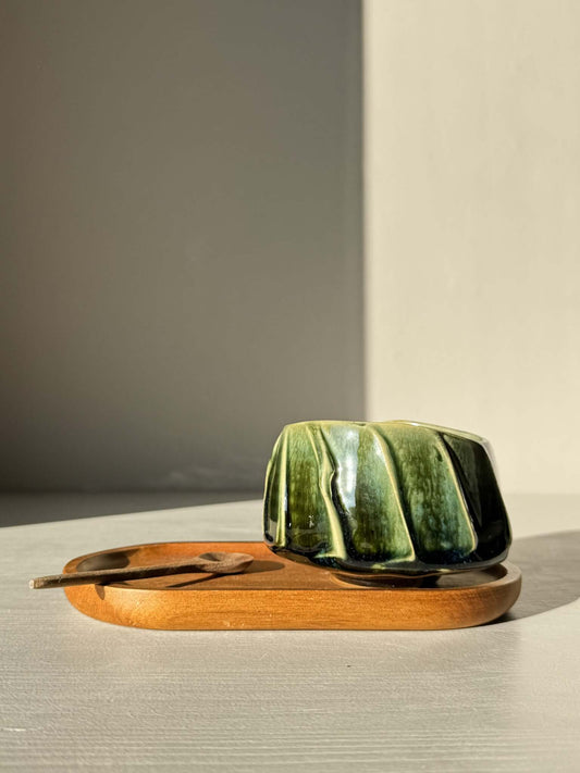 Yunomi Cup - Hinoki #28: Handcrafted green glazed cup with textured slip design, displayed on a wooden tray.