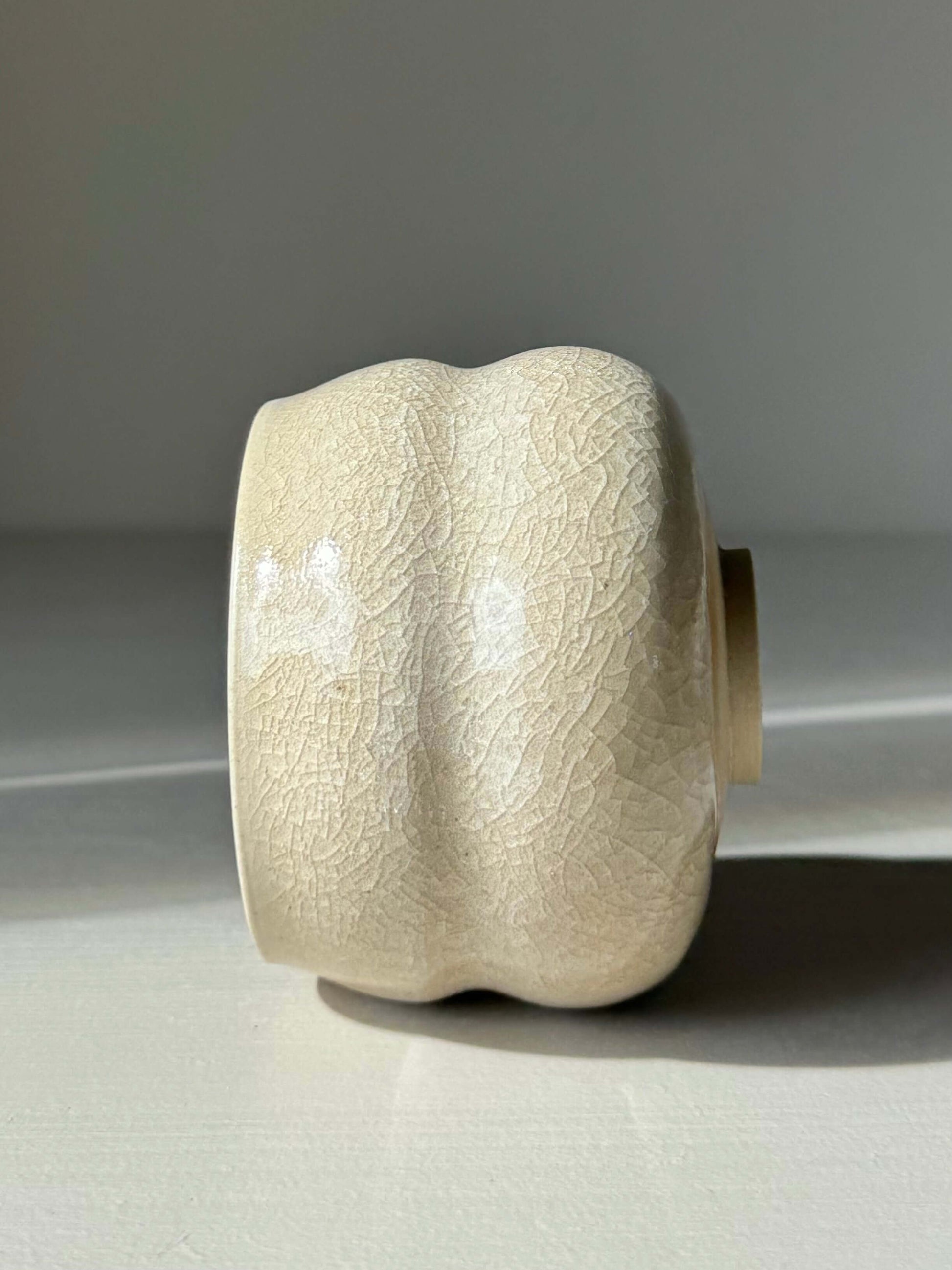 Yunomi Cup - Kannyū Series #11 with handmade ceramic crackle glaze on display. A unique, compact expression of traditional matcha bowls.
