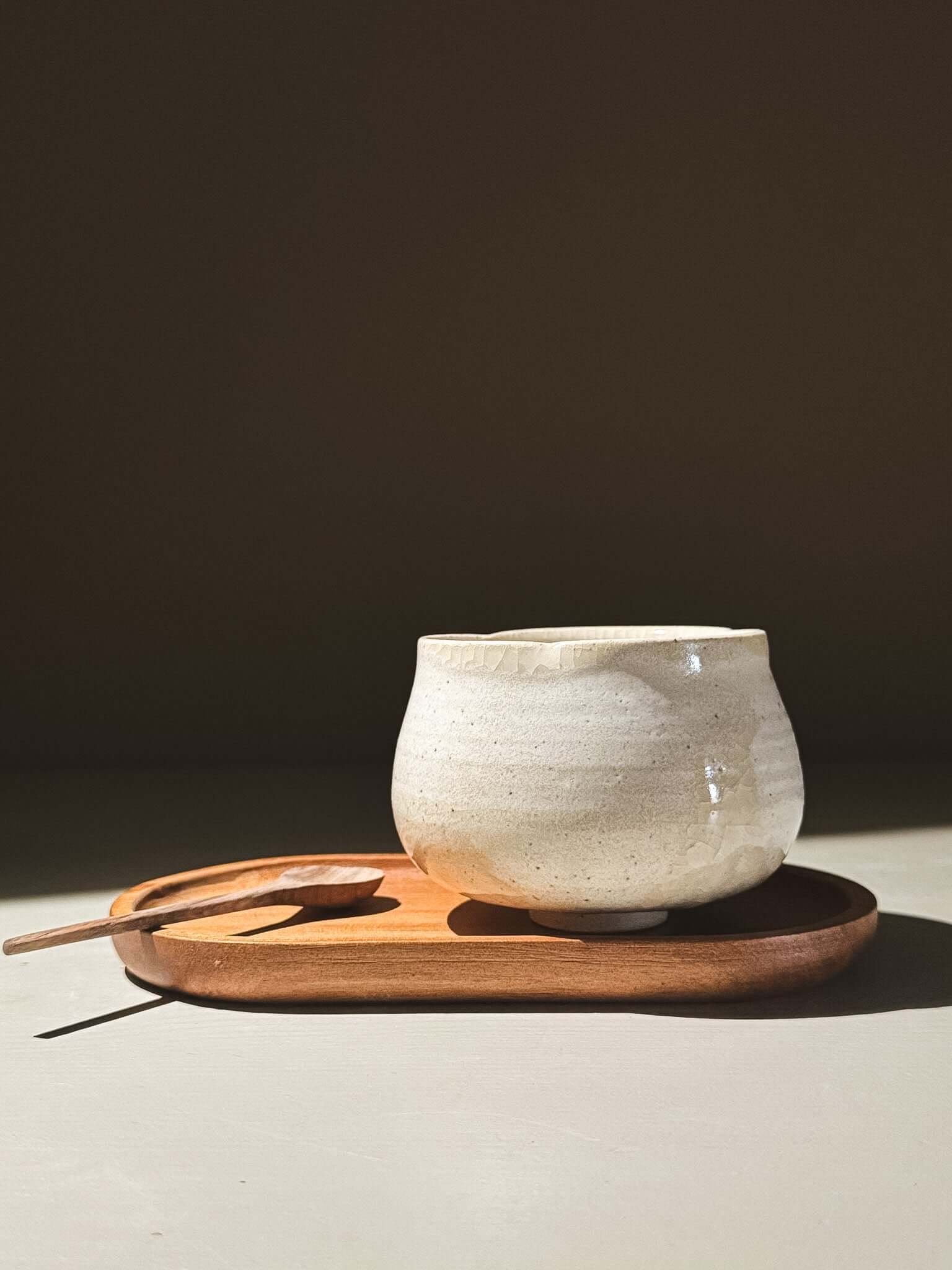 Yunomi Cup - Kannyū Series  #11 on a wooden tray with a spoon, showcasing its elegant design and crackle glaze.