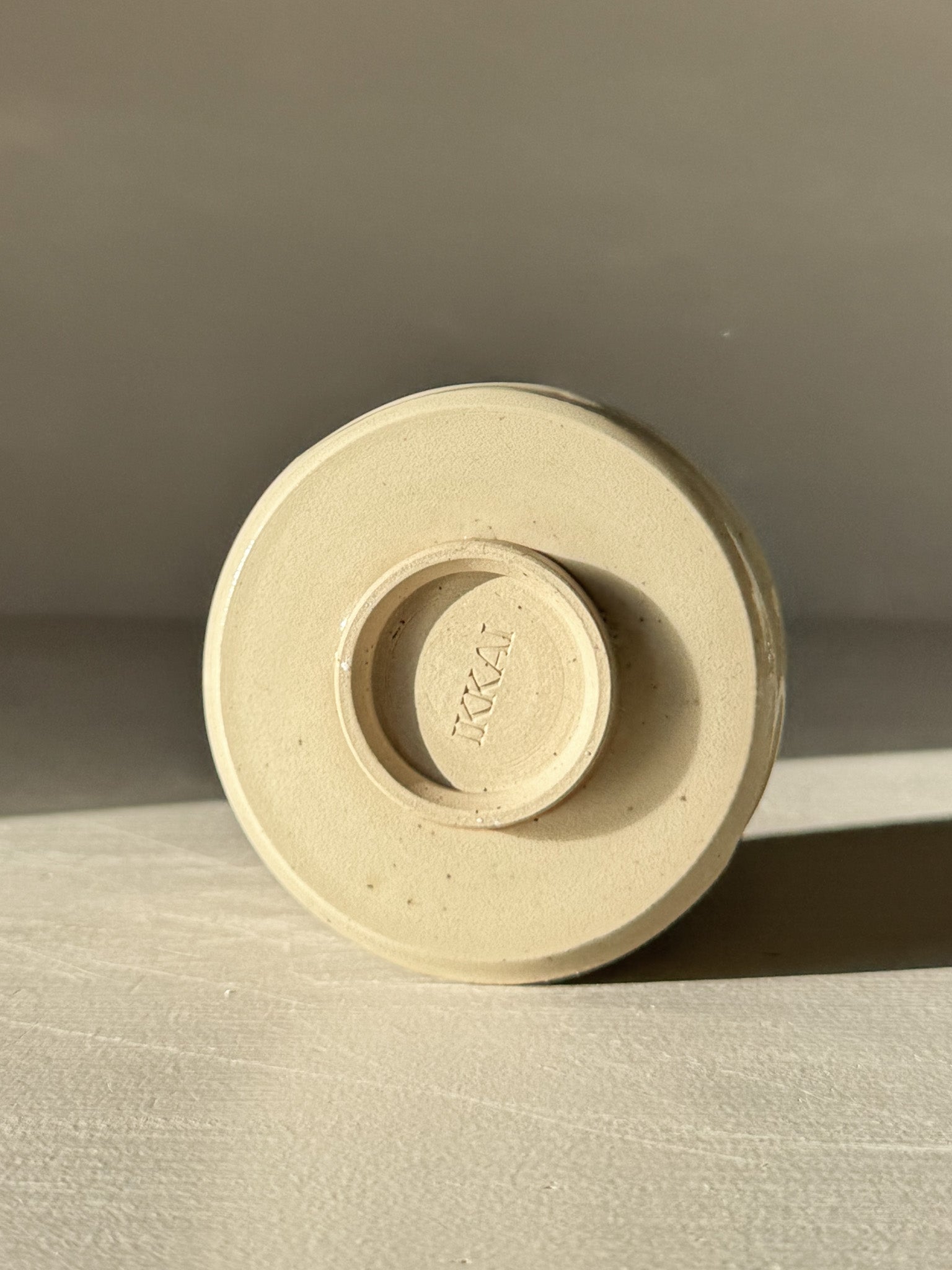Bottom view of Yunomi Cups - Clear Glaze #01 showcasing the stoneware base in natural lighting.