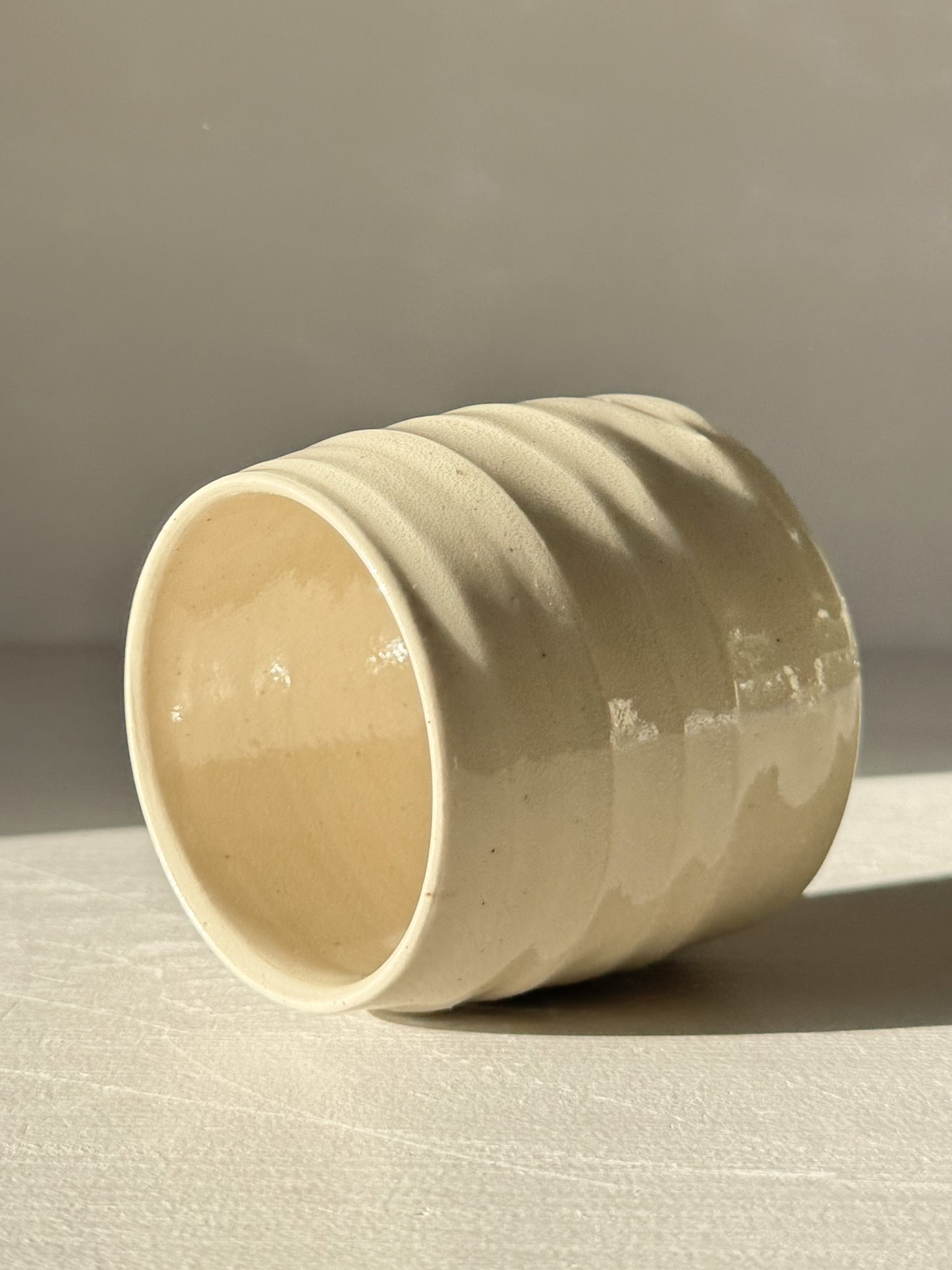 Yunomi Cups - Clear Glaze #02 with soft rounded form and subtle textured ridges, showcasing a transparent glaze and warm stoneware tones.