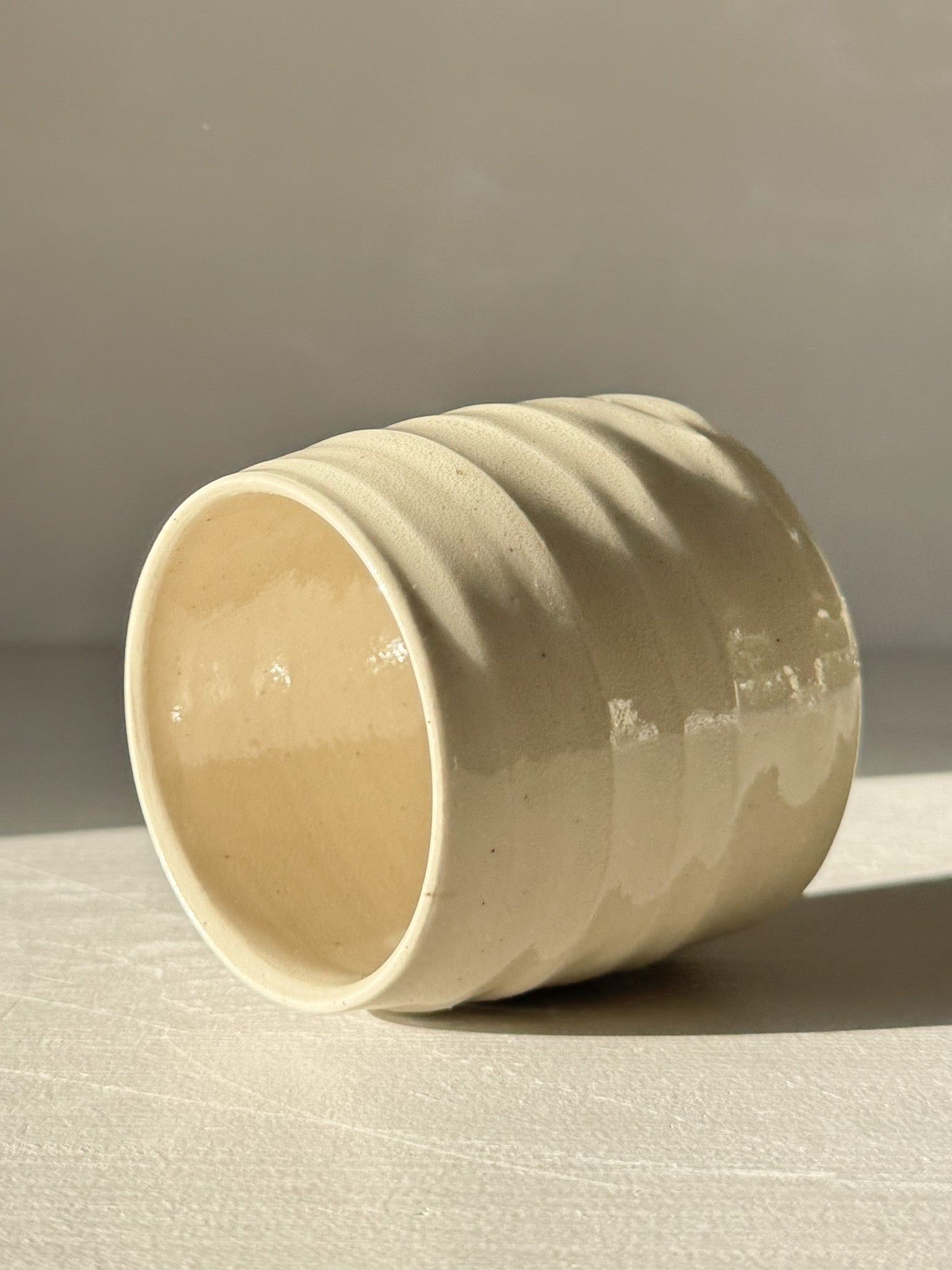 Yunomi Cups - Clear Glaze #02 with soft rounded form and subtle textured ridges, showcasing a transparent glaze and warm stoneware tones.