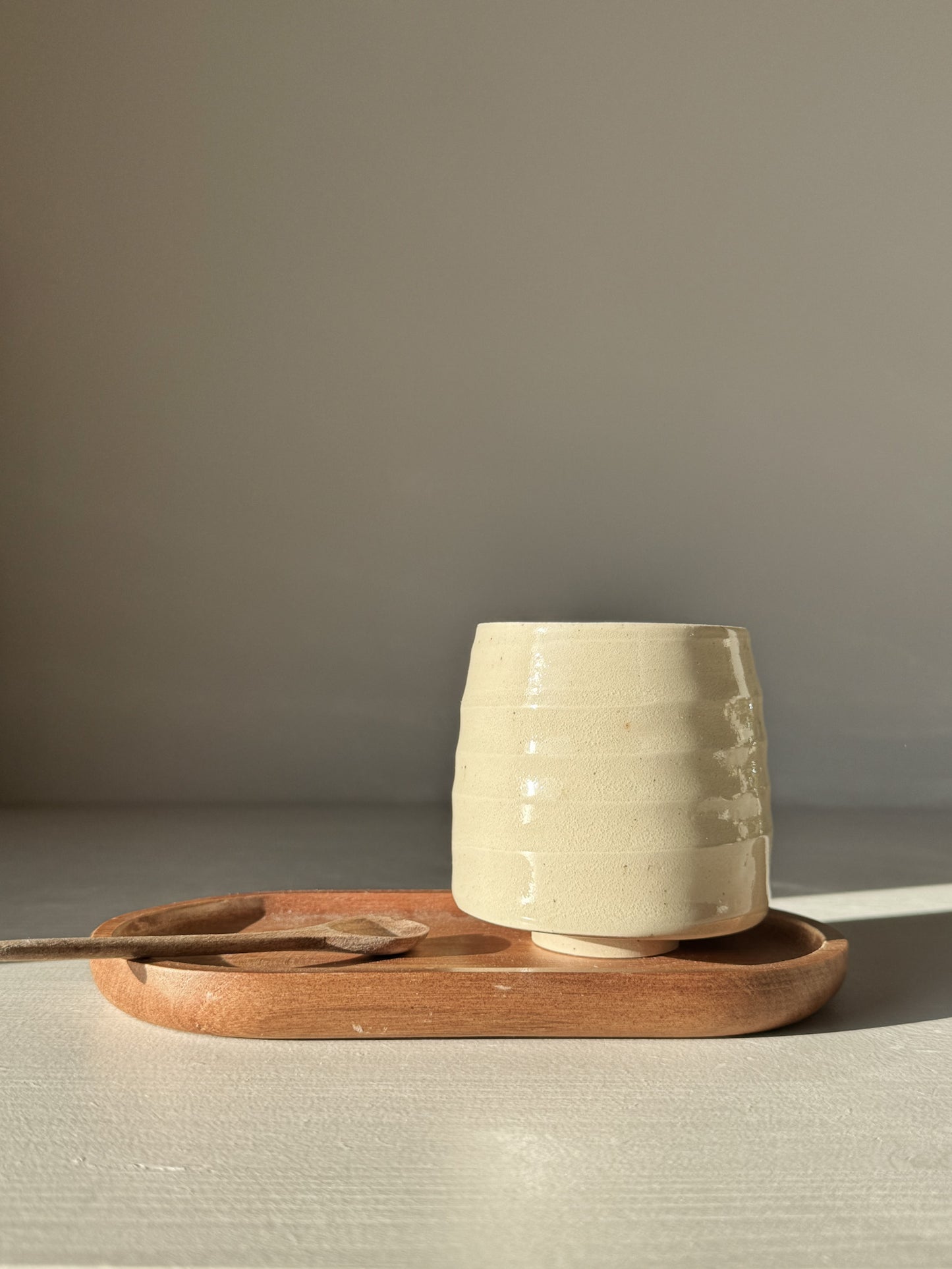 Yunomi Cups - Clear Glaze #02 with textured ridges on a wooden tray with a spoon