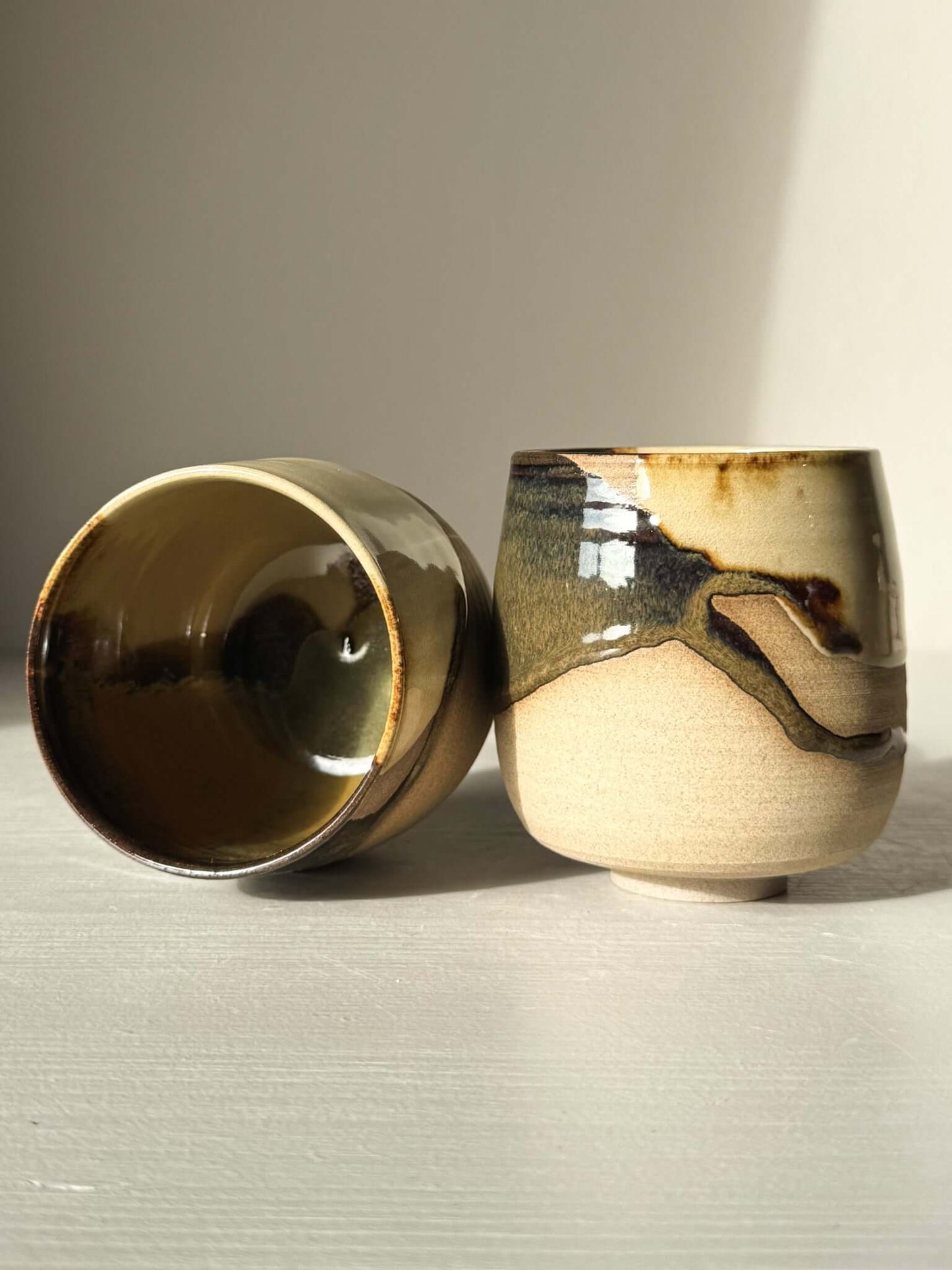 Yunomi Cups - Inyo with flowing white glaze and toffee clay, showcasing contrast of raw texture and glossy finish from the Inyo Series.