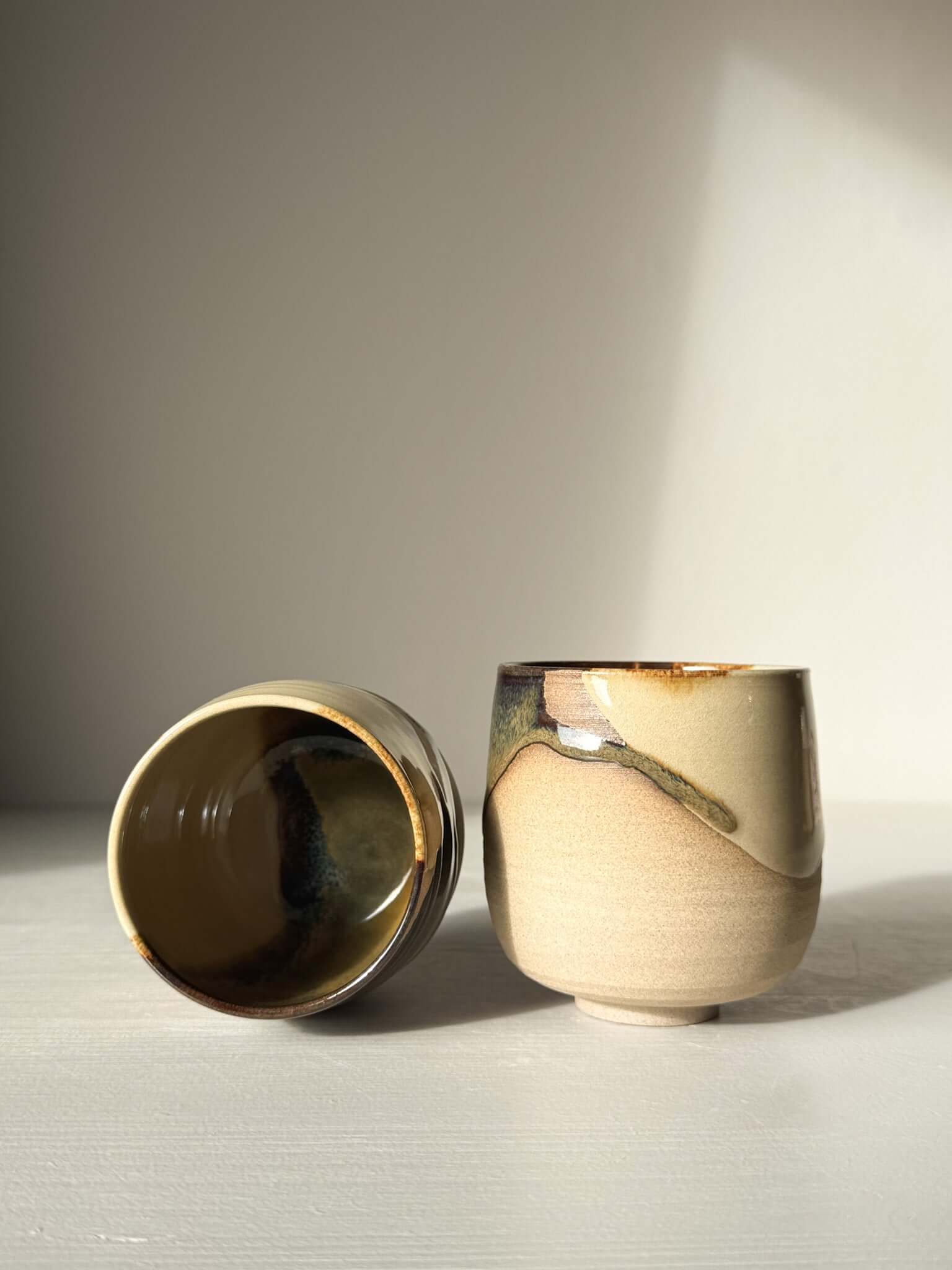 Yunomi Cups - Inyo with soft white glaze and toffee clay finish, showcasing contrast and calm in ceramic design.