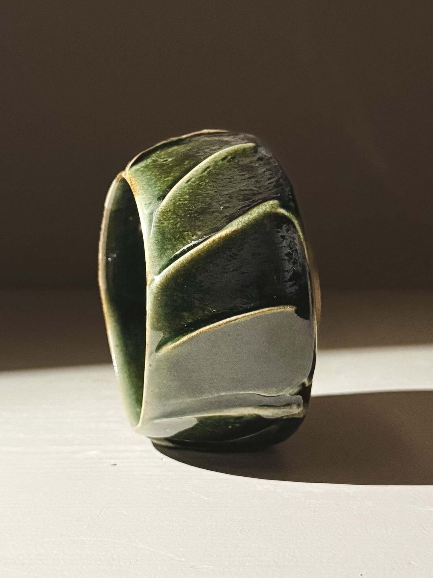 Yunomi Cup - Hinoki #00 with deep green glaze and hand-applied slip design for textured, unique tea experience.