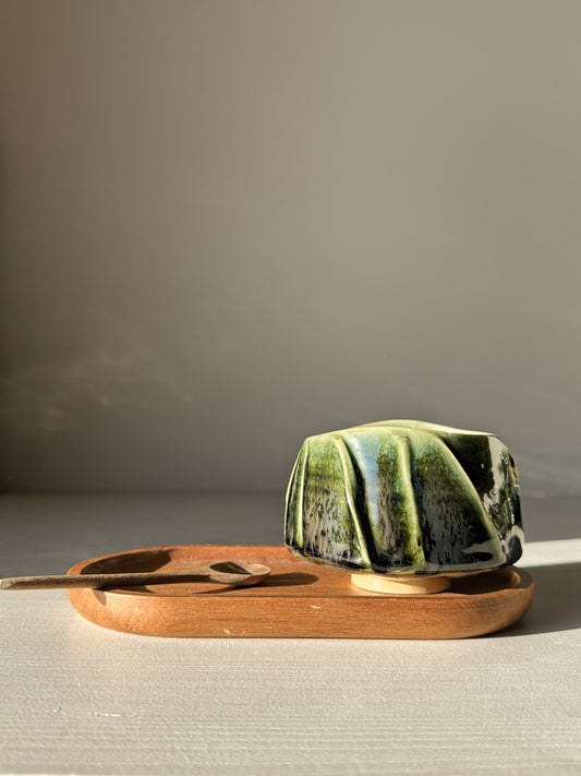 Handmade Yunomi Cup - Hinoki #06 with deep green glaze on wooden tray.