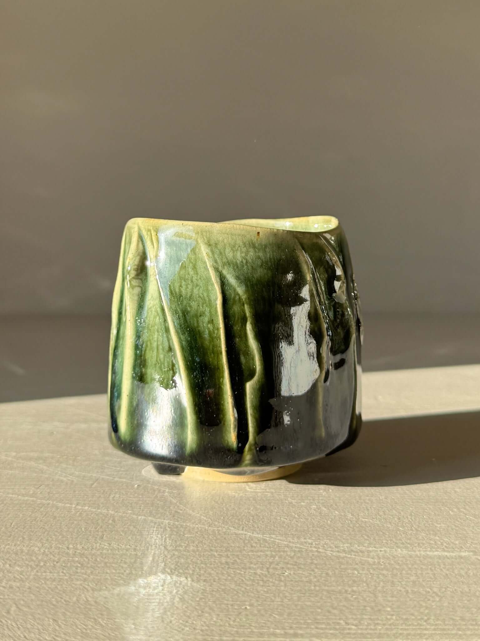Yunomi Cup - Hinoki #14 with hand-applied slip and deep green glaze creating texture and depth for everyday tea moments.
