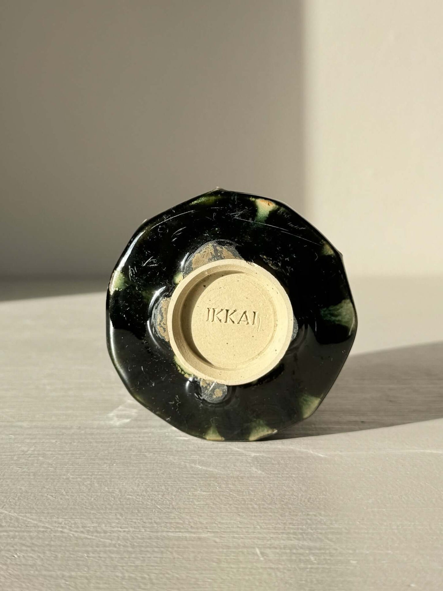 Bottom view of Yunomi Cup - Hinoki Series #19 with deep green glaze and unique slip texture, showcasing its handcrafted design.