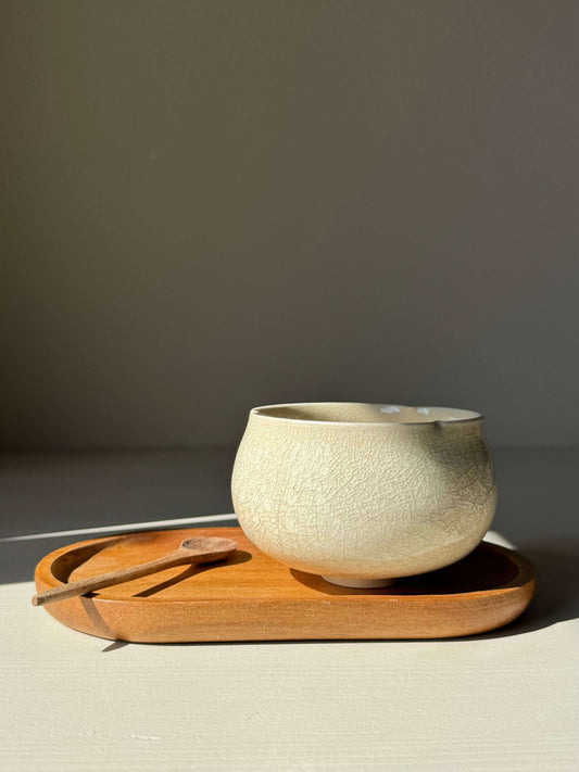 Yunomi Cup - Kannyū Series #12, a handmade ceramic tea cup with crackle glaze, on a wooden tray.
