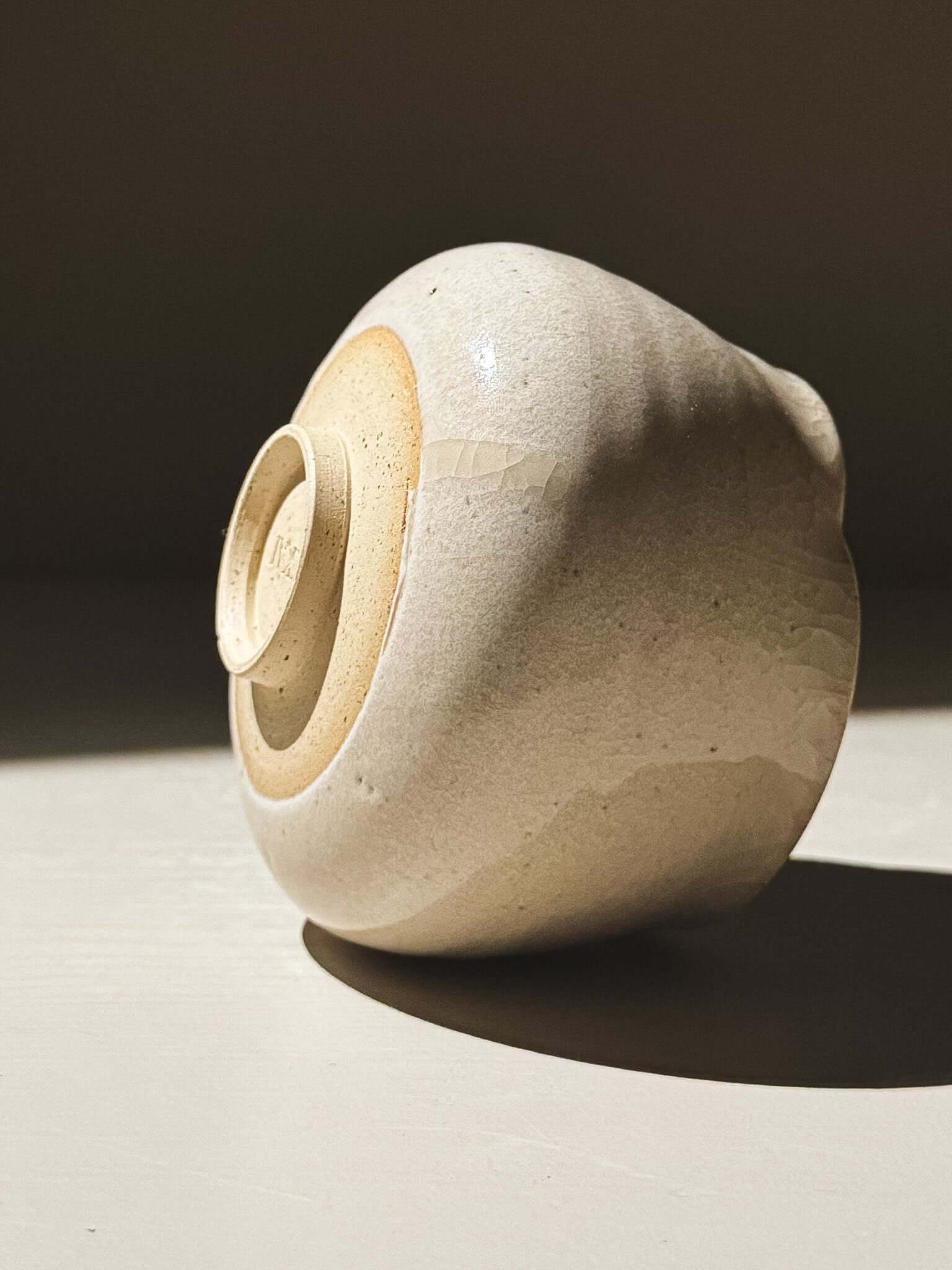 Yunomi Cup - Kannyū Series  #12 with delicate crackle glaze and softly flowing rim on display.