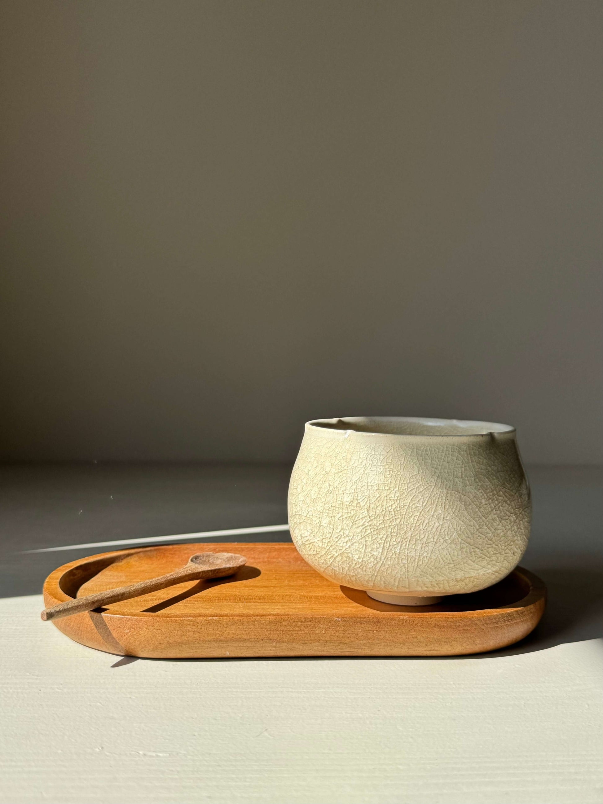Yunomi Cup - Kannyū Series #05, handmade ceramic teacup with crackle glaze on a wooden tray, showcasing elegant design for everyday tea.