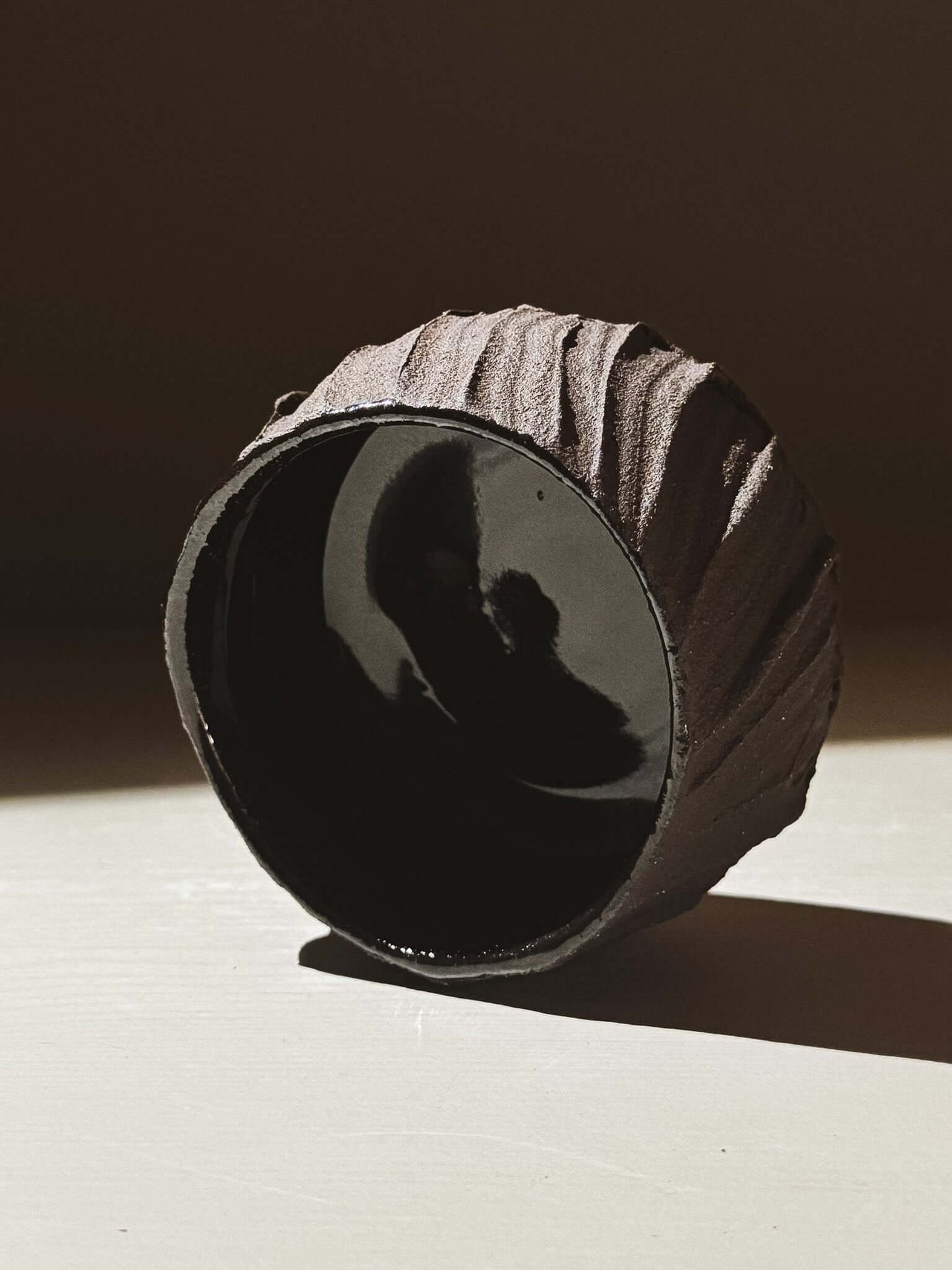 Yunomi Cup - Kuro #03 featuring textured dark brown clay and glossy black interior.